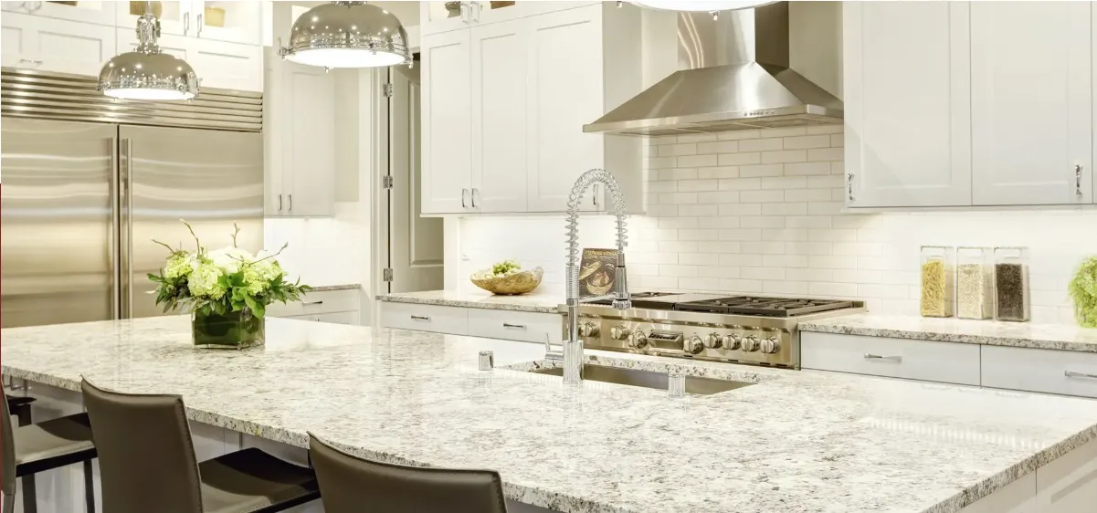 Granite countertop in a bright white kitchen